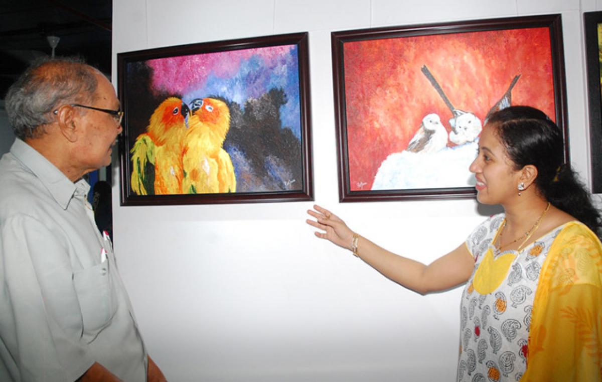Veteran journalist Turlapati Kutumba Rao going round a group art show at Aakriti Art Gallery in Vijayawada on Saturday (Hans Photo N Kishore) 